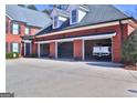 Spacious three-car garage providing ample parking and storage space for vehicles at 219 Eagles Landing Way, Mcdonough, GA 30253