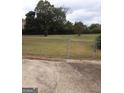 Large backyard with a chain-link fence surrounding the perimeter of the home at 1970 Pinecrest Dr, Morrow, GA 30260