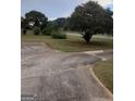Long driveway with ample parking space and well-maintained landscaping at 1970 Pinecrest Dr, Morrow, GA 30260