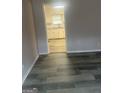 View of the kitchen from the living room, showing open concept and modern flooring at 1700 Mccollum Rd, Sw, Conyers, GA 30094