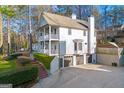 Spacious home featuring a three-car garage, a large backyard, and a two-story front porch at 2580 Defoors Ferry Nw Rd, Atlanta, GA 30318