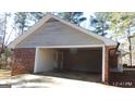 Spacious garage with brick exterior and ample room for parking and storage at 863 New Hope Dr, Hampton, GA 30228