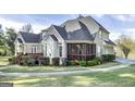 Expansive backyard showcasing the screened-in porch, perfect for outdoor relaxation and entertaining at 415 Oxmoor Lake Dr, Mcdonough, GA 30252