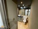 Compact bathroom featuring neutral tile, modern vanity, and essential fixtures at 2285 Peachtree Rd # 602, Atlanta, GA 30309