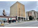 Apartment building complex with a modern facade, near a pool and commercial building at 2285 Peachtree Rd # 602, Atlanta, GA 30309