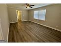 Spacious room featuring wood floors, neutral walls, and ample natural light at 2690 Rollingwood Se Ln, Atlanta, GA 30316
