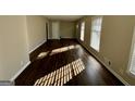 Open living room with hardwood floors, natural light, and freshly painted walls at 1965 Rollingwood Se Dr, Atlanta, GA 30316