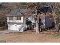 Charming two-story home with landscaped yard, two-car garage, and welcoming front steps at 70 Willow Bend Nw Dr, Cartersville, GA 30121