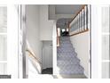 Bright foyer with carpeted stairs and white railing, leading to the upper level at 70 Willow Bend Nw Dr, Cartersville, GA 30121