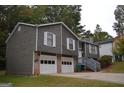 Attractive split-level home with a two-car garage and charming curb appeal at 5475 Pepperwood Ct, Stone Mountain, GA 30087