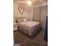 Comfortable bedroom with plush carpet and a nicely decorated bed at 945 Bethany Rd, Covington, GA 30016