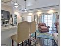 Open living area with dark floors and large windows with lots of light at 747 S Fairfield Dr, Peachtree City, GA 30269