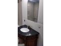 Bathroom featuring a vanity with a dark countertop, waiting for finishing touches to complete the renovation at 4571 Scarborough Rd, South Fulton, GA 30349