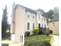 Two-story home featuring neutral siding, a driveway, and a well-maintained lawn at 3497 Thornewoode Pointe, Decatur, GA 30034