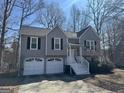 Charming gray two-story home with a two-car garage and a well-manicured front yard at 159 Aztec Se Way, Acworth, GA 30102