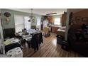 A combined kitchen and dining area with ample table space and kitchen storage at 159 Aztec Se Way, Acworth, GA 30102