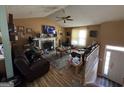 Spacious living room featuring a fireplace, plush seating, and ample natural light at 159 Aztec Se Way, Acworth, GA 30102