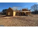 The exterior shows a new construction, with the wood frame nearly complete and ready for finishing touches at 462 Snead Road # 2, Fayetteville, GA 30215