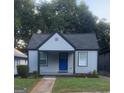 Charming one-story home with a blue front door and well manicured lawn at 1066 Ashby Sw Grv, Atlanta, GA 30314