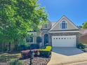 Charming single-Gathering home with stone accents, manicured landscaping, and attached garage at 168 Maple Grove Ter, Peachtree City, GA 30269
