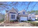 Charming home featuring stone accents, a two-car garage, and well-maintained landscaping at 168 Maple Grove Ter, Peachtree City, GA 30269