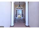 Elegant front entrance featuring stately columns, glass doorway, and stone steps at 168 Maple Grove Ter, Peachtree City, GA 30269