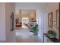 Inviting hallway with an arched doorway leading to a bright and spacious living area at 168 Maple Grove Ter, Peachtree City, GA 30269