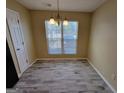 Bright dining room with a window and a chandelier at 3535 Waldrop Trl, Decatur, GA 30034