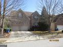 Inviting two-story brick home with a two-car garage and manicured landscaping at 4286 Rosehall Ct, South Fulton, GA 30349