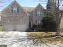 Attractive brick home featuring a two-car garage and neat front yard at 4286 Rosehall Ct, South Fulton, GA 30349