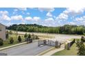 Exterior shot of the gated entrance to the community at 1720 Goodwin Dr # 75, Hampton, GA 30228