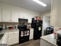 Efficient kitchen with modern appliances and white cabinets at 5509 Park Place South, Atlanta, GA 30349