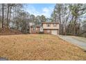 Charming two-story brick home with a well-manicured front yard and an inviting driveway at 620 Bell Se Rd, Conyers, GA 30094