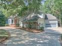 Beautiful home with a curved driveway leading to an attached two-car garage at 101 Glen Eagle Way, Mcdonough, GA 30253