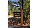 Rustic community sign reading PINEGATE, surrounded by lush greenery at 3 Bob Smith Rd, Sharpsburg, GA 30277