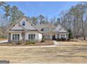 Charming one story home with beautiful landscaping, shingle, and stone accents at 209 Wynnward Way, Sharpsburg, GA 30277