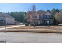 Inviting two-story home with a manicured front yard and an extended driveway at 4205 Lindsey Way, Conyers, GA 30013