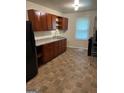 Efficient kitchen features wood cabinets and ample counter space for meal preparation at 3720 Asbury Sw Ln, Atlanta, GA 30331