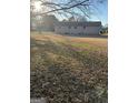 Large backyard with mature trees and plenty of space for outdoor activities at 30 Lemon Pl, Mcdonough, GA 30253