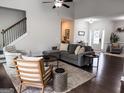 Comfortable living room featuring hardwood floors and stylish seating at 9178 Lakeview Pkwy, Villa Rica, GA 30180