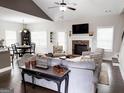 Spacious living room with vaulted ceiling, fireplace, and elegant furnishings at 9178 Lakeview Pkwy, Villa Rica, GA 30180