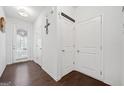 Bright hallway featuring hardwood floors and white trim at 2271 Rolling Trl, Lithonia, GA 30058