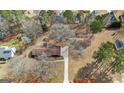 Expansive aerial view of a secluded home surrounded by mature trees and lush greenery at 210 Heritage Cir, Mcdonough, GA 30253