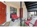 Inviting porch with cozy seating area, perfect for relaxation at 555 Windchase Ln, Stone Mountain, GA 30083