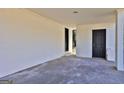 Spacious carport featuring a concrete floor and neutral painted brick walls and doors at 3047 Horse Shoe Se Dr, Atlanta, GA 30316