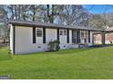 Well-kept single Gathering home with manicured lawn, and a classic and welcoming facade at 3047 Horse Shoe Se Dr, Atlanta, GA 30316