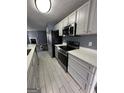 Modern kitchen with stainless steel appliances and bright white countertops at 2747 Vining Ridge Ter, Decatur, GA 30034