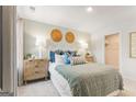 Bright bedroom features a cozy queen bed, neutral colors, natural textures, and recessed lighting at 988 Sutherland Lane # 33, Lawrenceville, GA 30043