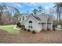 View of the side and front of the house at 238 Harvest Trce, Sharpsburg, GA 30277