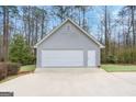 A large detached two-car garage with a white garage door at 238 Harvest Trce, Sharpsburg, GA 30277